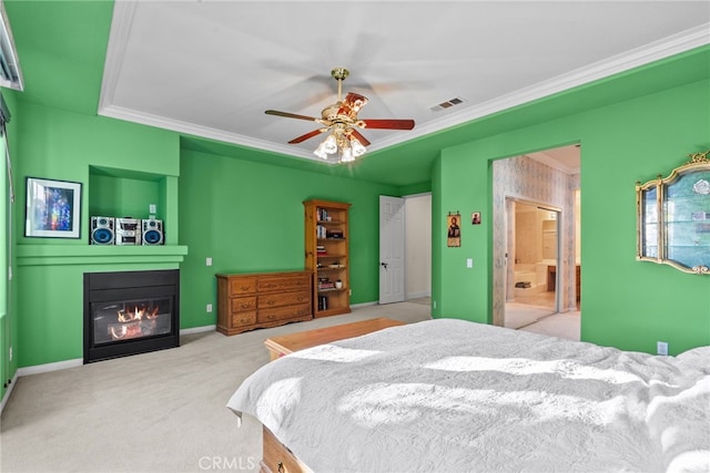 22440 Skylake Pl, Saugus, CA 91390 - carpeted bedroom with a glass covered fireplace, crown molding, ensuite bath, baseboards, and a ceiling fan