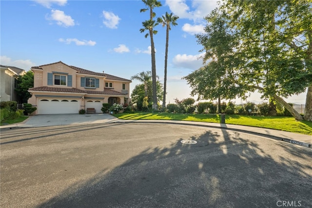 22440 Skylake Pl, Saugus, CA 91390 - view of front facade with a garage, driveway, a tiled roof, and stucco siding