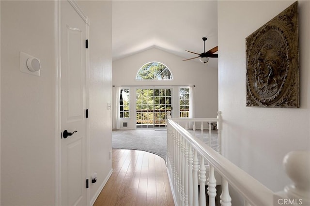 26350 Spyglass Dr, Lake Arrowhead, CA 92352 - corridor with lofted ceiling, an upstairs landing, hardwood / wood-style flooring, and baseboards