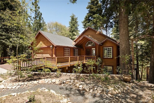 26350 Spyglass Dr, Lake Arrowhead, CA 92352 - chalet / cabin featuring a wooden deck, an attached garage, and concrete driveway