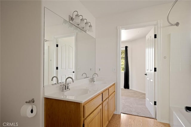 26350 Spyglass Dr, Lake Arrowhead, CA 92352 - full bathroom with double vanity, wood finished floors, and shower / bathtub combination