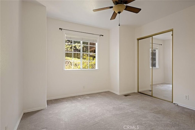 26350 Spyglass Dr, Lake Arrowhead, CA 92352 - unfurnished bedroom with carpet, a closet, baseboards, and ceiling fan