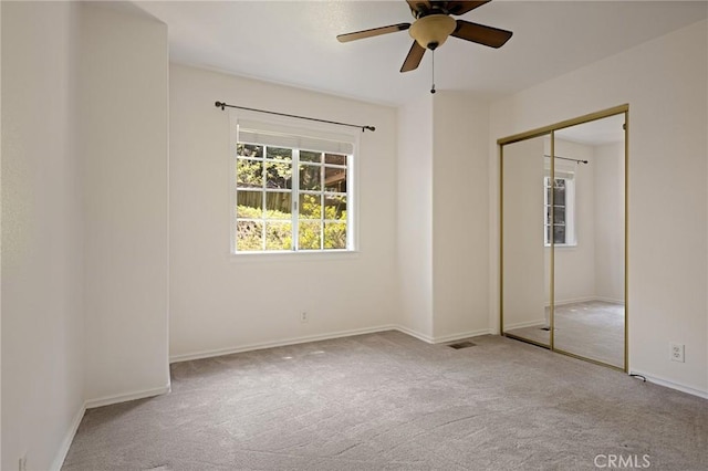 26350 Spyglass Dr, Lake Arrowhead, CA 92352 - unfurnished bedroom with carpet floors, a closet, and a ceiling fan
