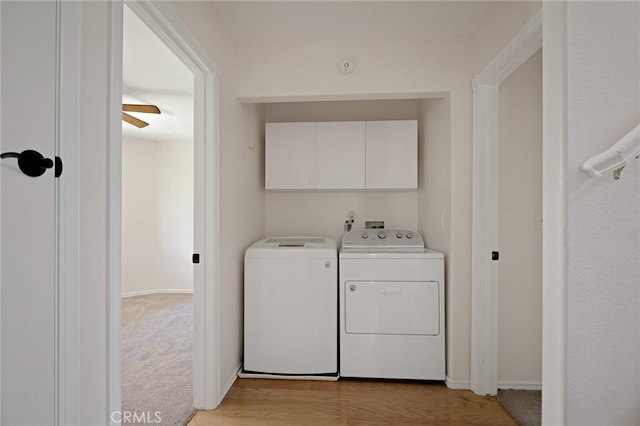 26350 Spyglass Dr, Lake Arrowhead, CA 92352 - laundry room featuring independent washer and dryer, cabinet space, and light wood finished floors