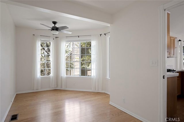 26350 Spyglass Dr, Lake Arrowhead, CA 92352 - spare room featuring light wood-type flooring, a ceiling fan, and baseboards