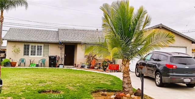 16614 Samgerry Dr, La Puente, CA 91744 - view of front of house featuring stucco siding, a front lawn, a shingled roof, and a garage