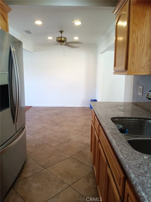 16614 Samgerry Dr, La Puente, CA 91744 - kitchen with stainless steel fridge with ice dispenser, ceiling fan, recessed lighting, dark stone countertops, and dark tile patterned flooring
