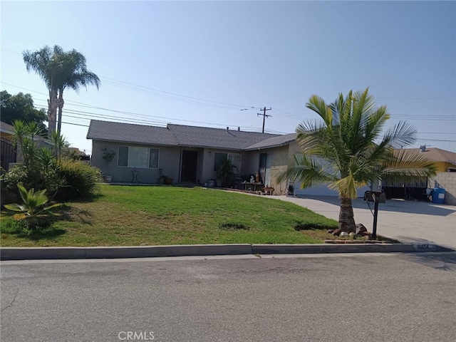 16614 Samgerry Dr, La Puente, CA 91744 - ranch-style house featuring driveway, a front yard, and stucco siding