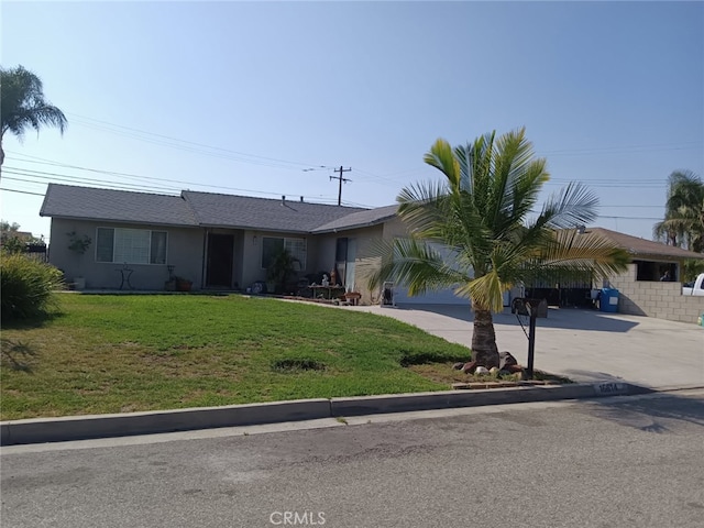 16614 Samgerry Dr, La Puente, CA 91744 - ranch-style house with driveway, a front lawn, and stucco siding