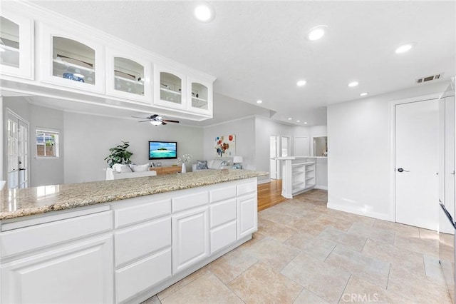 338 Laurel Ave, Arcadia, CA 91006 - kitchen featuring ceiling fan, recessed lighting, white cabinetry, glass insert cabinets, and light stone counters