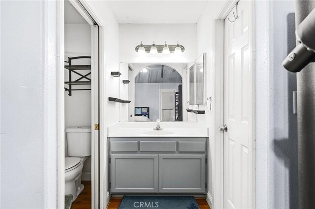 258 Vail Dr, Chico, CA 95973 - bathroom featuring toilet, vanity, and wood finished floors