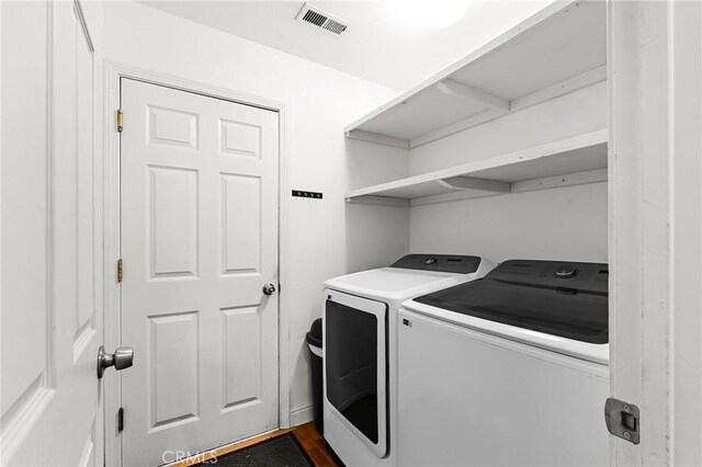 258 Vail Dr, Chico, CA 95973 - laundry area featuring washer and dryer and dark wood-type flooring