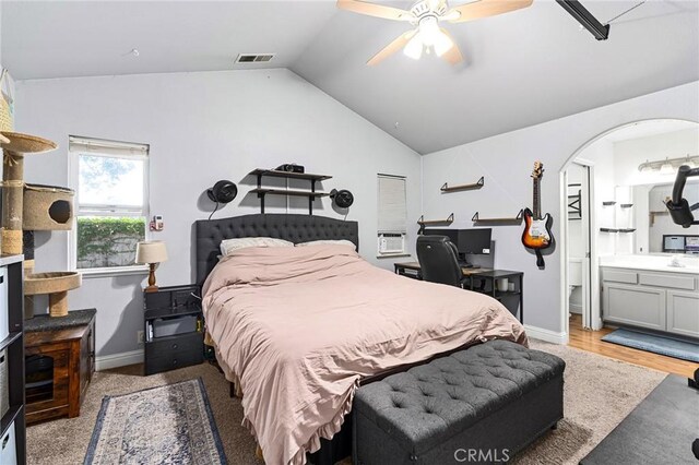 258 Vail Dr, Chico, CA 95973 - bedroom featuring lofted ceiling, ensuite bath, ceiling fan, baseboards, and cooling unit