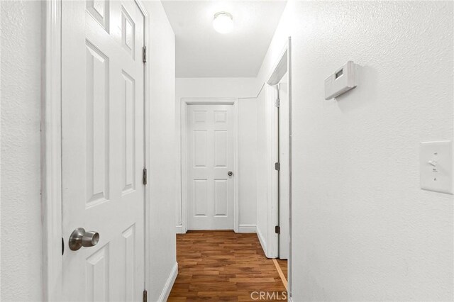 258 Vail Dr, Chico, CA 95973 - hallway featuring wood finished floors and baseboards