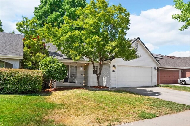 258 Vail Dr, Chico, CA 95973 - view of front of house featuring an attached garage, concrete driveway, and a front yard