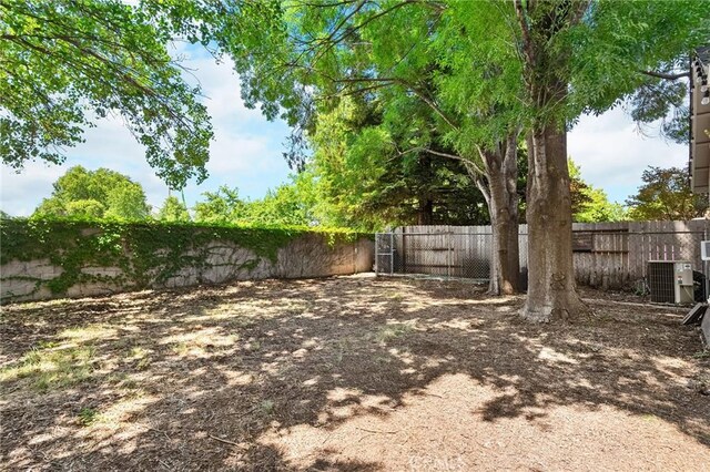 258 Vail Dr, Chico, CA 95973 - fenced backyard featuring central AC unit