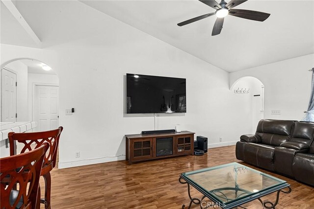 258 Vail Dr, Chico, CA 95973 - living room with arched walkways, a ceiling fan, wood finished floors, baseboards, and high vaulted ceiling