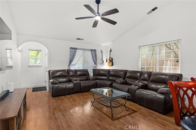 258 Vail Dr, Chico, CA 95973 - living area featuring ceiling fan, wood finished floors, arched walkways, and high vaulted ceiling