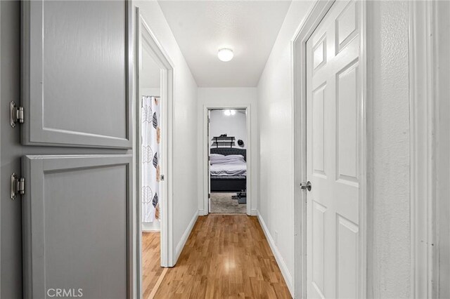258 Vail Dr, Chico, CA 95973 - corridor with baseboards and light wood-style flooring