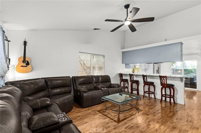 258 Vail Dr, Chico, CA 95973 - living room with a ceiling fan, wood finished floors, and high vaulted ceiling