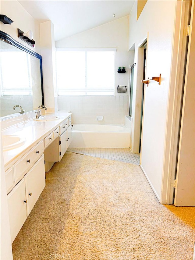 23878 Bouquet Canyon Pl, Moreno Valley, CA 92557 - full bath with a bath, double vanity, vaulted ceiling, plenty of natural light, and carpet floors
