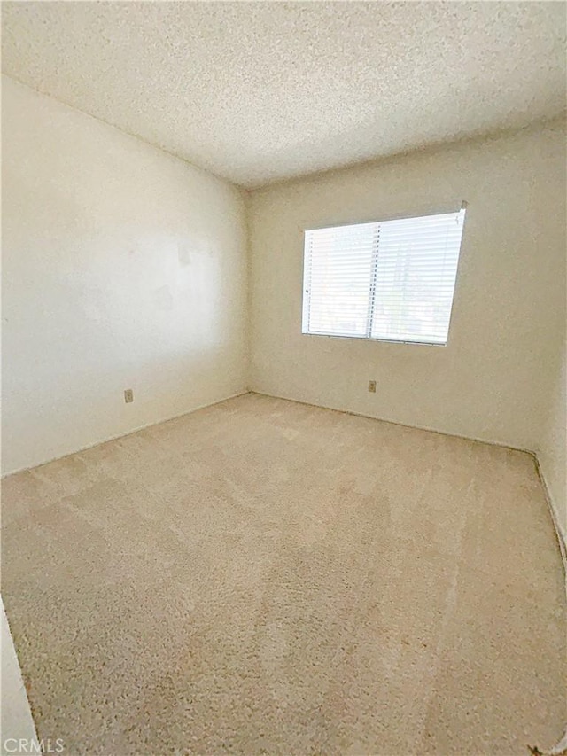 23878 Bouquet Canyon Pl, Moreno Valley, CA 92557 - carpeted empty room with a textured ceiling