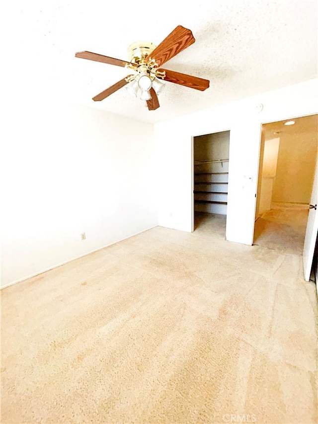 23878 Bouquet Canyon Pl, Moreno Valley, CA 92557 - unfurnished bedroom with light carpet, a ceiling fan, and a closet