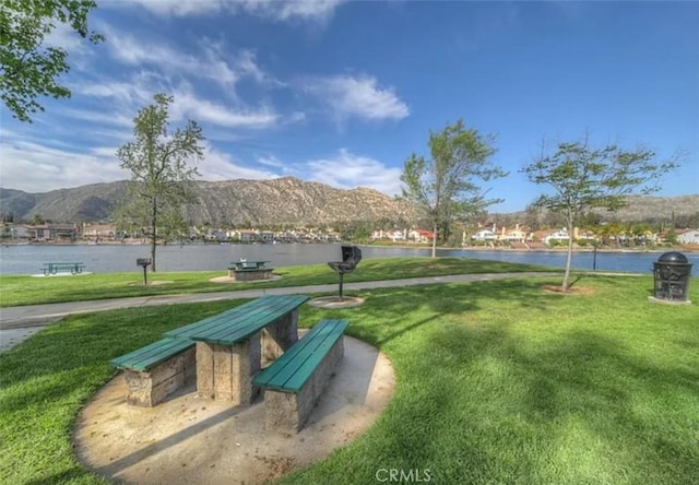 23878 Bouquet Canyon Pl, Moreno Valley, CA 92557 - view of home's community featuring a yard and a water and mountain view