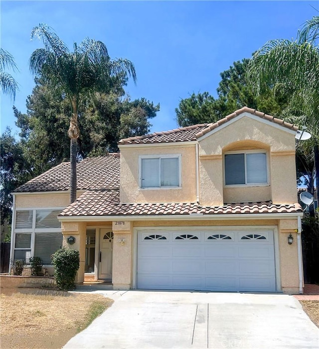 23878 Bouquet Canyon Pl, Moreno Valley, CA 92557 - view of front of home with driveway, a tile roof, and stucco siding