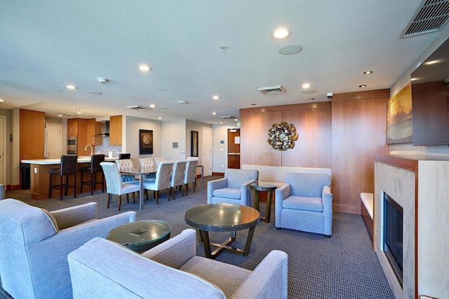 325 7th Unit 1501, San Diego, CA 92101 - living area featuring carpet, recessed lighting, baseboards, and a fireplace