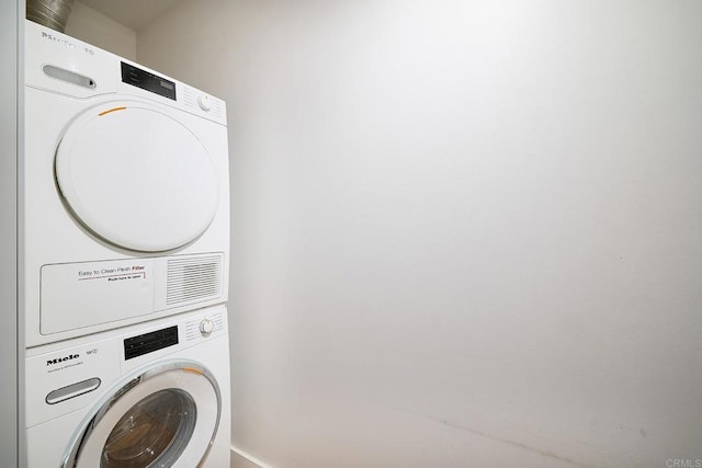 325 7th Unit 1501, San Diego, CA 92101 - washroom with stacked washer / dryer and baseboards
