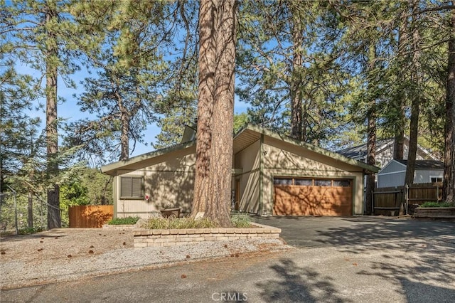 31297 All View Dr, Running Springs, CA 92382 - mid-century home featuring asphalt driveway and a garage