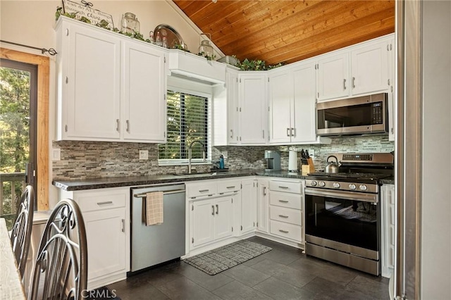 31297 All View Dr, Running Springs, CA 92382 - kitchen featuring appliances with stainless steel finishes, wooden ceiling, vaulted ceiling, a sink, and decorative backsplash