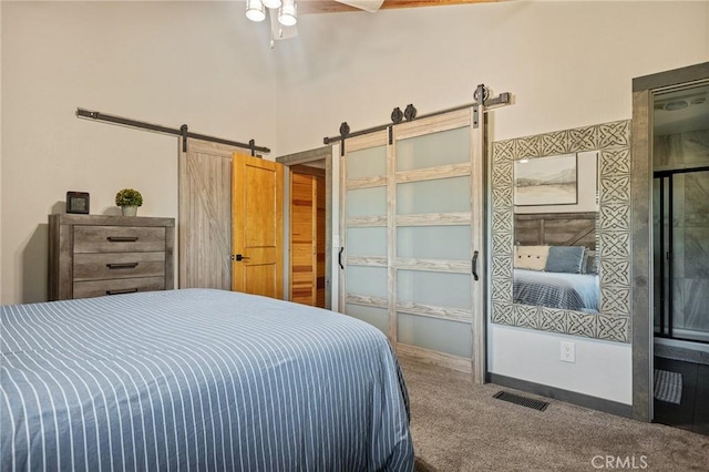 31297 All View Dr, Running Springs, CA 92382 - bedroom featuring a barn door and carpet floors