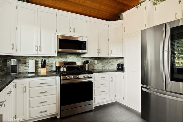 31297 All View Dr, Running Springs, CA 92382 - kitchen featuring appliances with stainless steel finishes, wooden ceiling, white cabinetry, tasteful backsplash, and lofted ceiling
