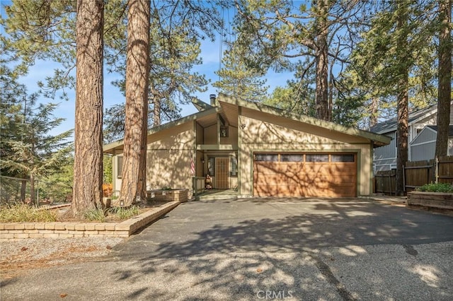 31297 All View Dr, Running Springs, CA 92382 - mid-century home featuring asphalt driveway and a garage
