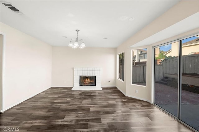 30470 Bayport Ln, Menifee, CA 92584 - unfurnished living room with wood finished floors, a chandelier, baseboards, and a fireplace