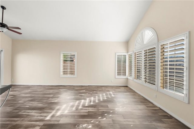 30470 Bayport Ln, Menifee, CA 92584 - unfurnished living room featuring ceiling fan, lofted ceiling, plenty of natural light, wood finished floors, and baseboards