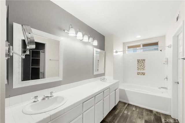 30470 Bayport Ln, Menifee, CA 92584 - bathroom with shower / bath combination, double vanity, and wood finished floors