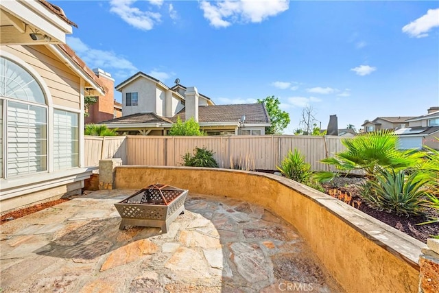 30470 Bayport Ln, Menifee, CA 92584 - fenced backyard featuring a patio, a fire pit, and a residential view