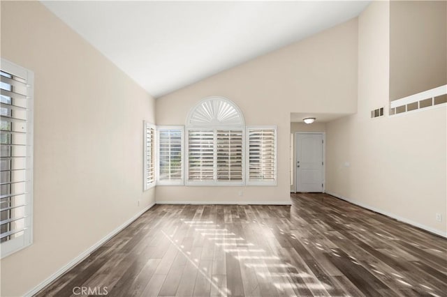 30470 Bayport Ln, Menifee, CA 92584 - empty room with high vaulted ceiling, wood finished floors, and baseboards