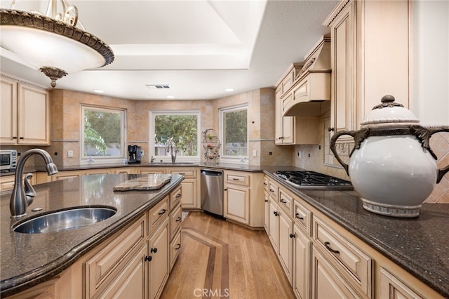 8790 King Ranch Rd, Rancho Cucamonga, CA 91701 - kitchen featuring cream cabinets, appliances with stainless steel finishes, light wood-type flooring, tasteful backsplash, and recessed lighting