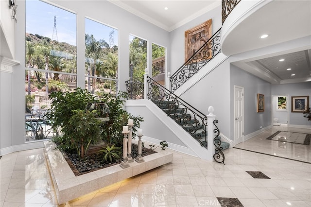 8790 King Ranch Rd, Rancho Cucamonga, CA 91701 - foyer entrance featuring marble tiled flooring, stairway, recessed lighting, and crown molding