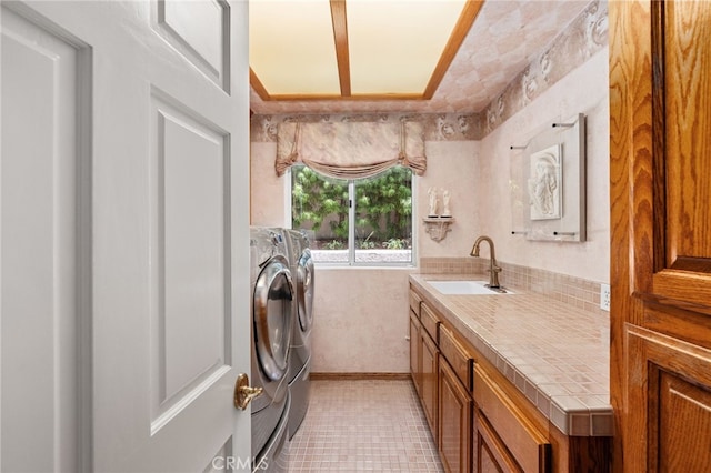 8790 King Ranch Rd, Rancho Cucamonga, CA 91701 - laundry room with washer and clothes dryer and cabinet space