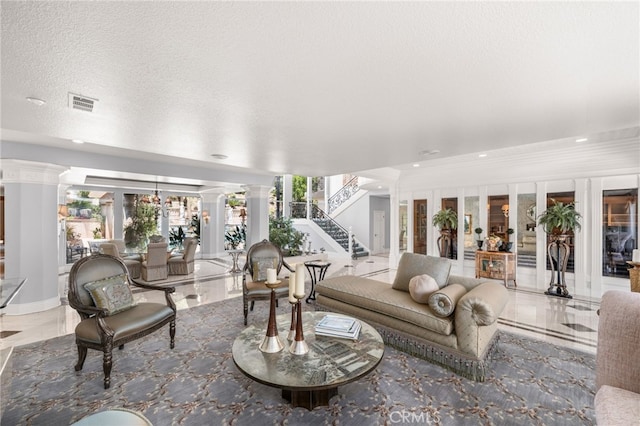 8790 King Ranch Rd, Rancho Cucamonga, CA 91701 - living room with ornate columns, recessed lighting, and stairway