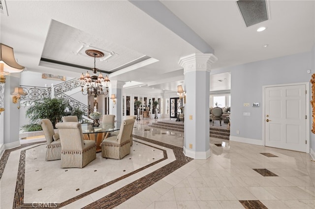 8790 King Ranch Rd, Rancho Cucamonga, CA 91701 - dining area with ornate columns, a raised ceiling, recessed lighting, a chandelier, and inlaid floor details