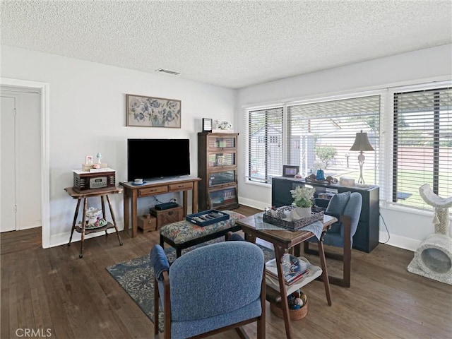 9513 Prichard St, Bellflower, CA 90706 - living area featuring baseboards, wood finished floors, a textured ceiling, and healthy amount of natural light