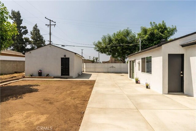5402 N Fairvalley Ave, Covina, CA 91722 - view of yard featuring a patio area and an outdoor structure