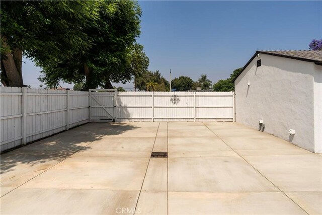 5402 N Fairvalley Ave, Covina, CA 91722 - fenced backyard with a patio area and a gate