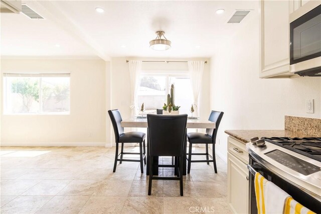 5402 N Fairvalley Ave, Covina, CA 91722 - dining room with plenty of natural light, ornamental molding, and recessed lighting